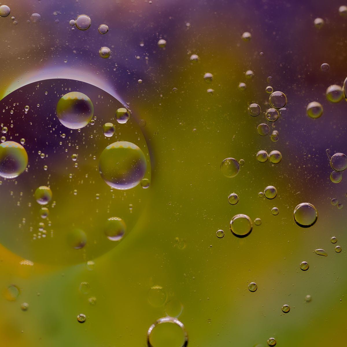 Photorealistic close-up of a small clear glass dropper bottle of light