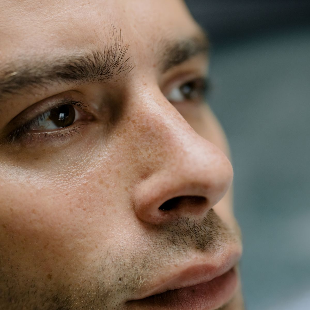 Close-up of a man's brow and nose area, where both seborrheic dermatitis and eczema commonly appear