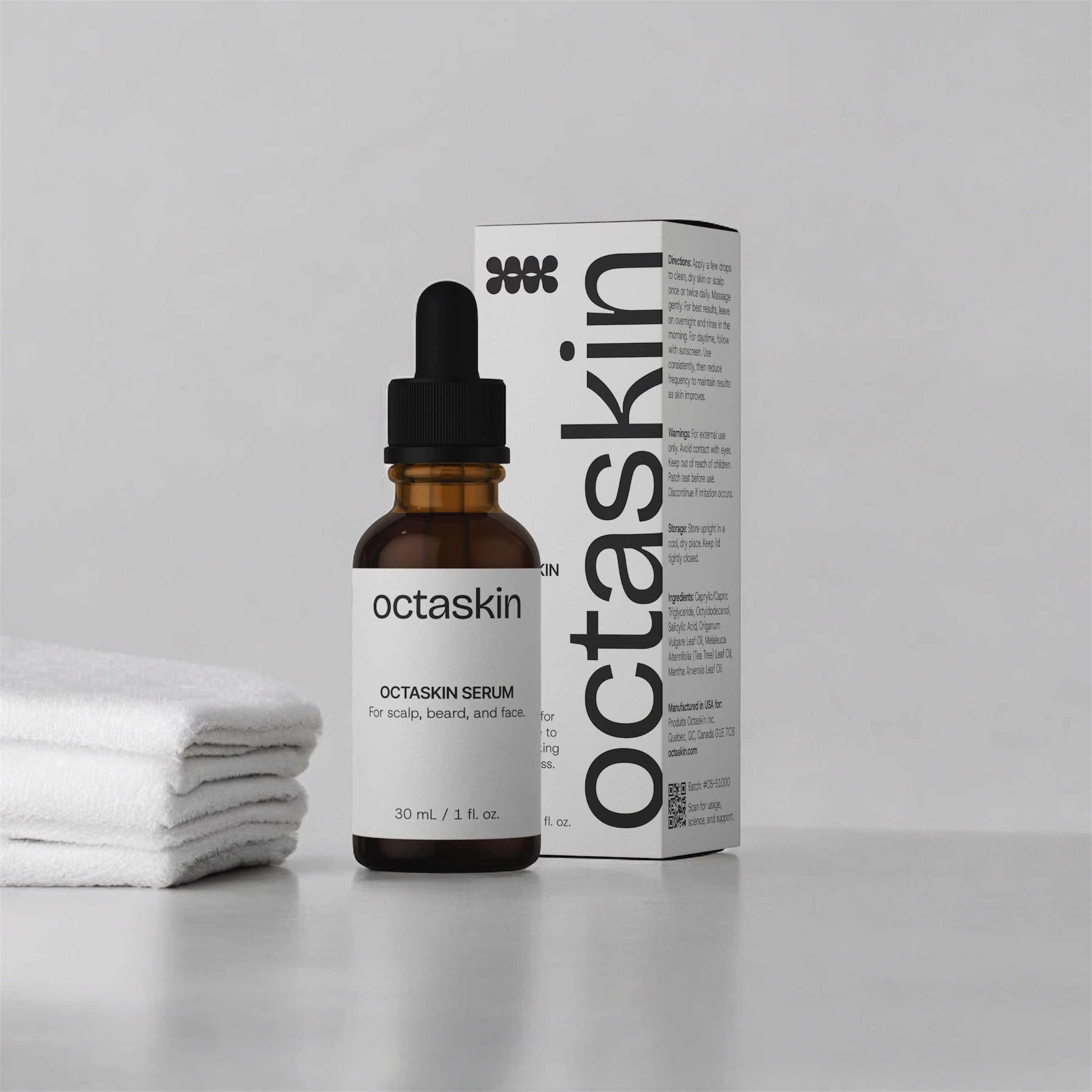 Octaskin serum bottle and packaging on a gray background