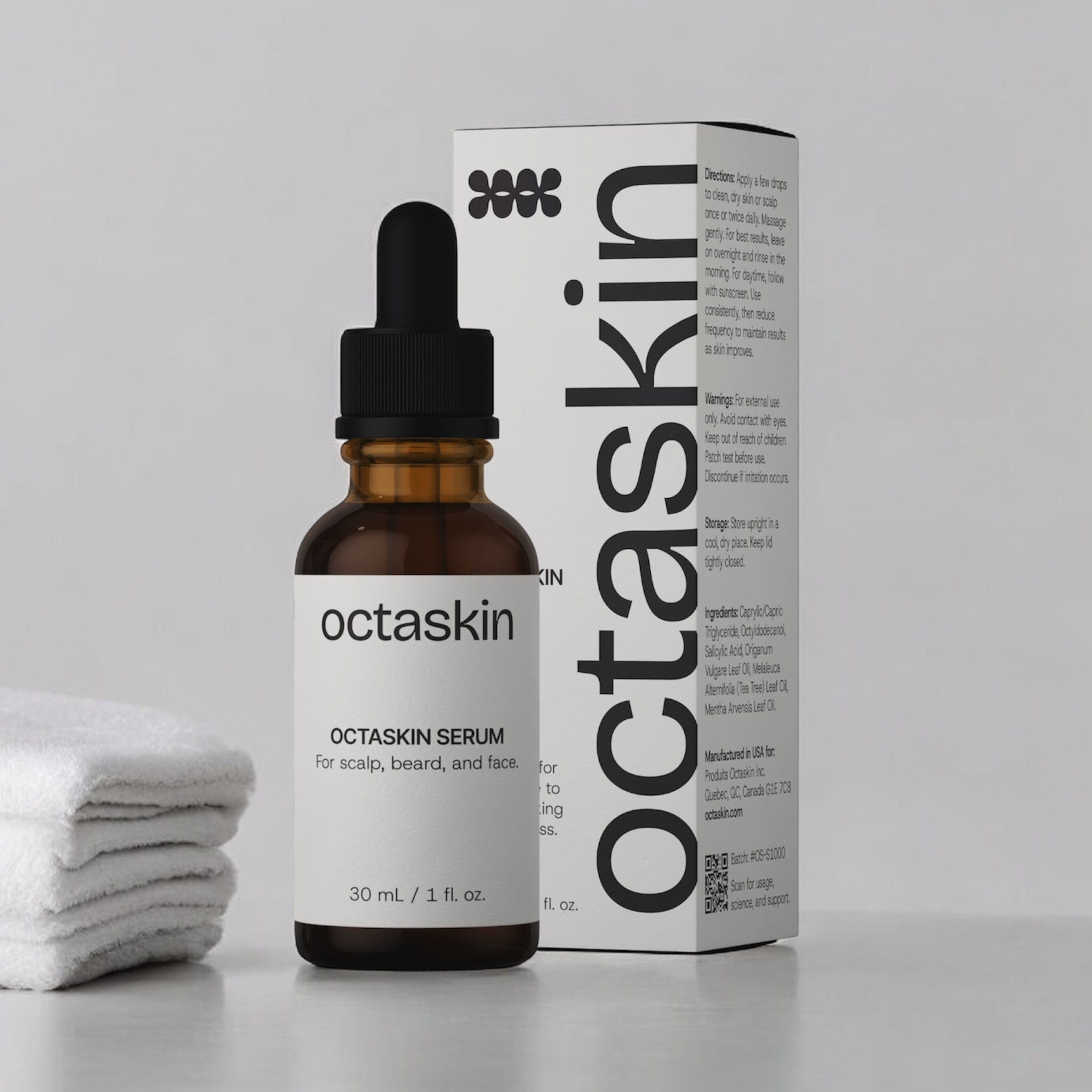 Octaskin serum bottle and packaging on a gray background