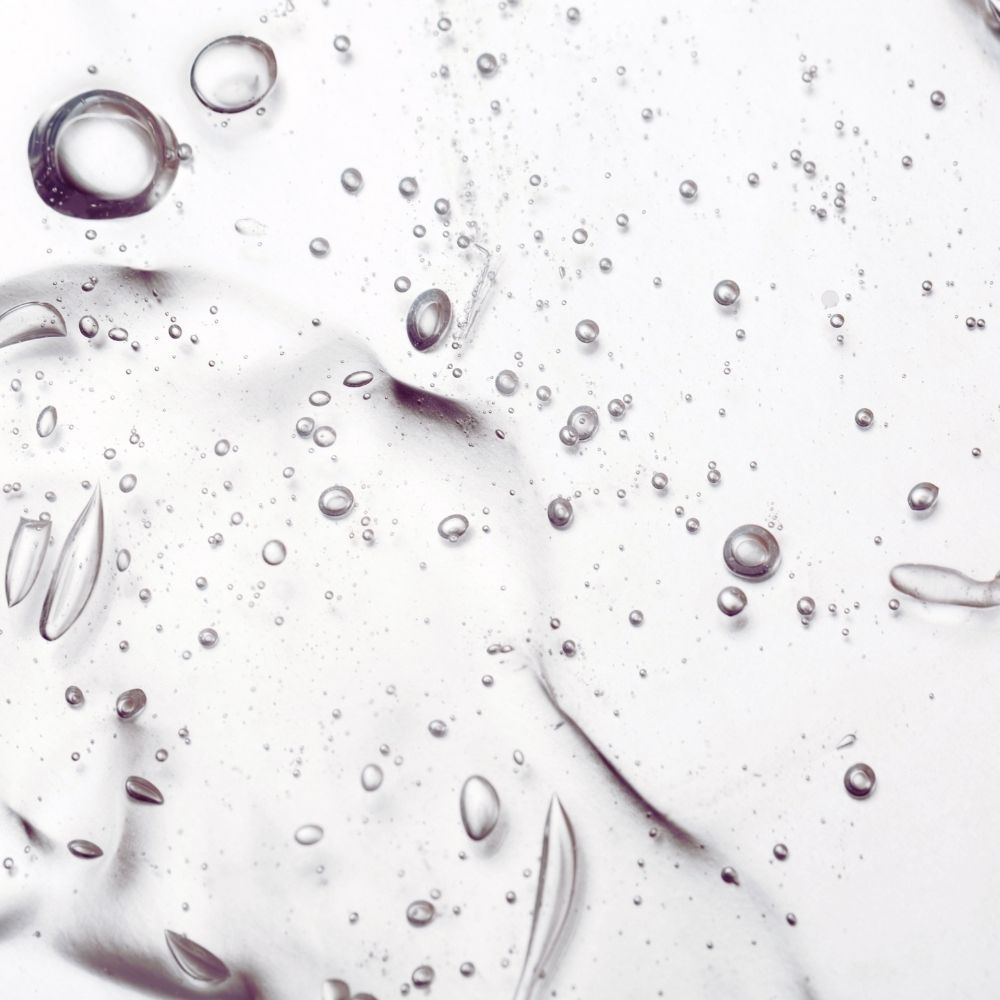 Close-up of octaskin serum droplets on a white background